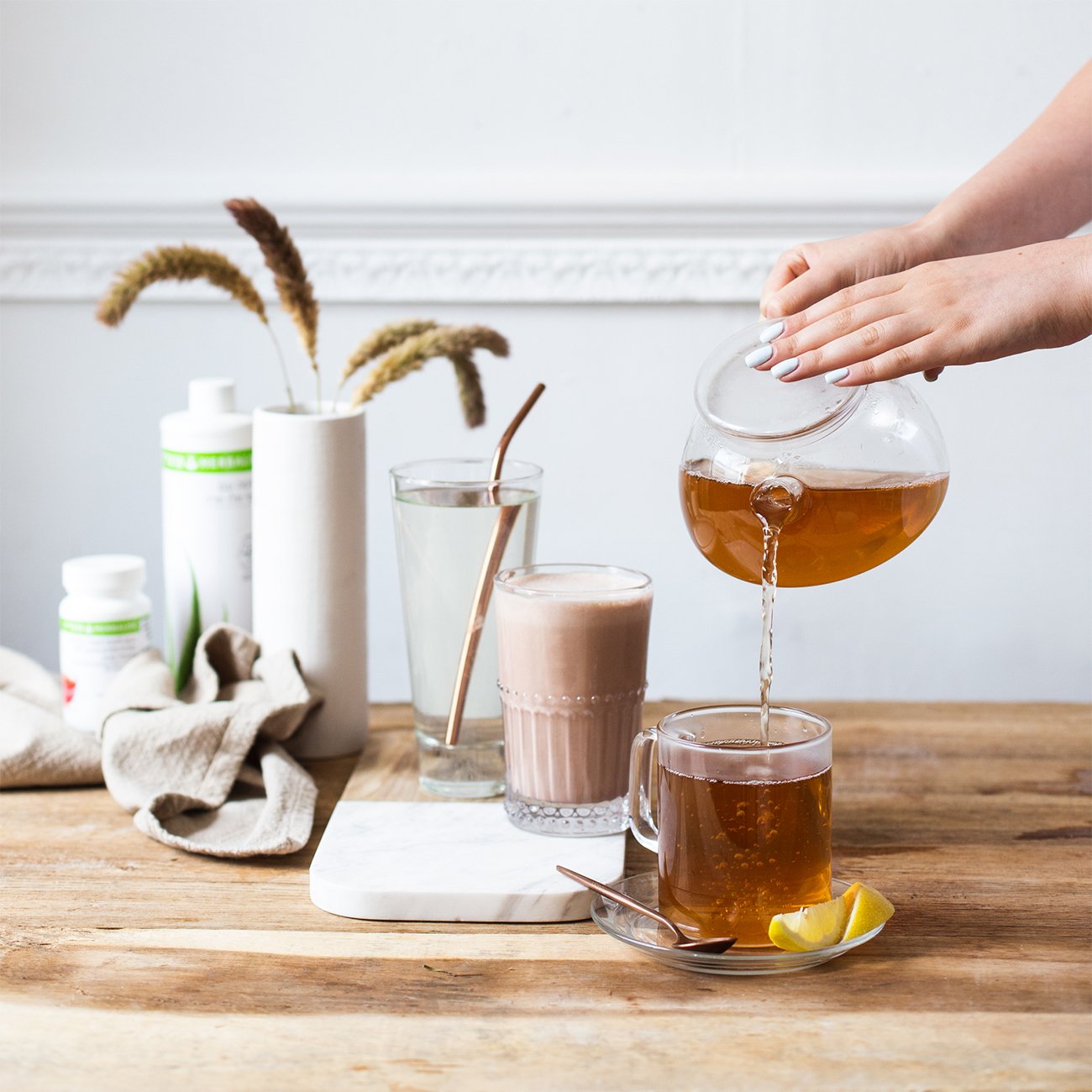 herbalife-nutrition-healthy-breakfast-and-hand-pouring-lemon-tea-in-a-cup